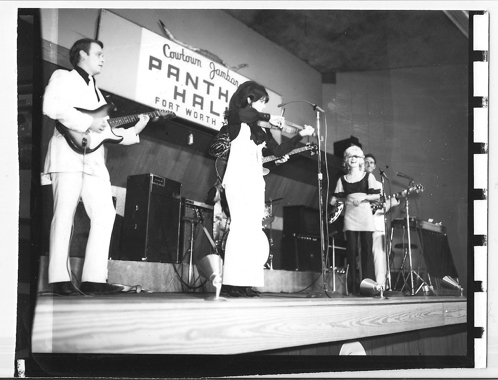The Mandrell Sisters featuring Louise Mandrell on fiddle and Barbara with tambourine on stage with band at Panther Hall