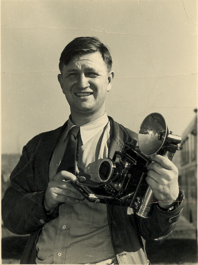 Image of Russell Lee as a young man holding a camera