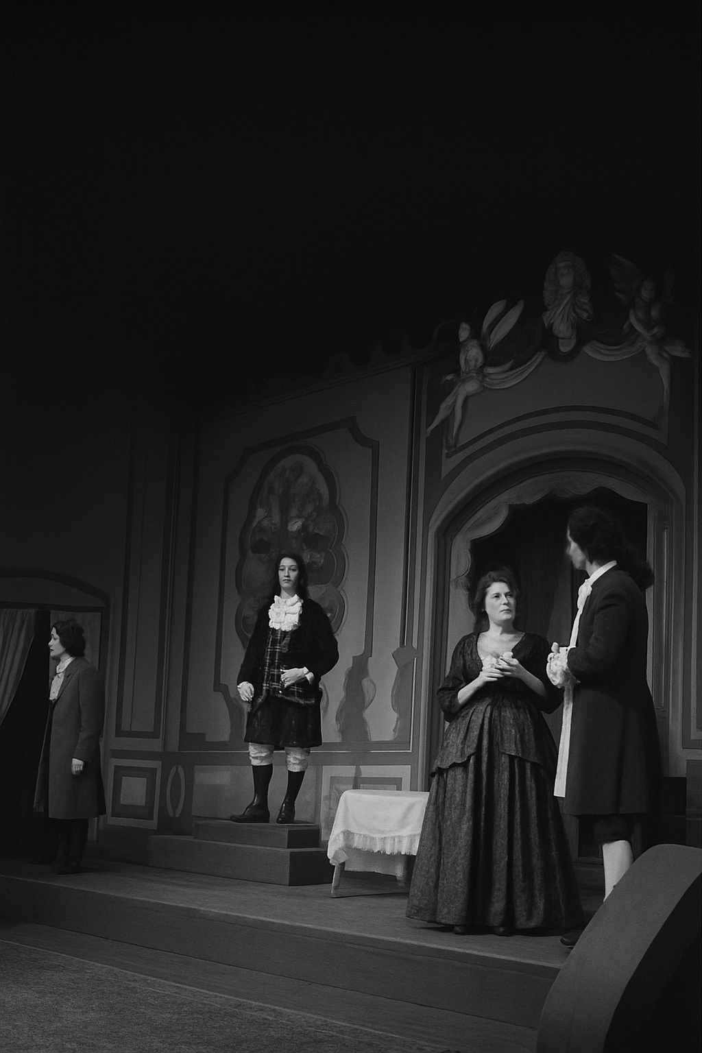 Actors in 17th century costume during a theater production.